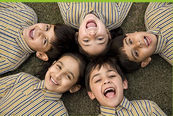 Children smiling in a circle